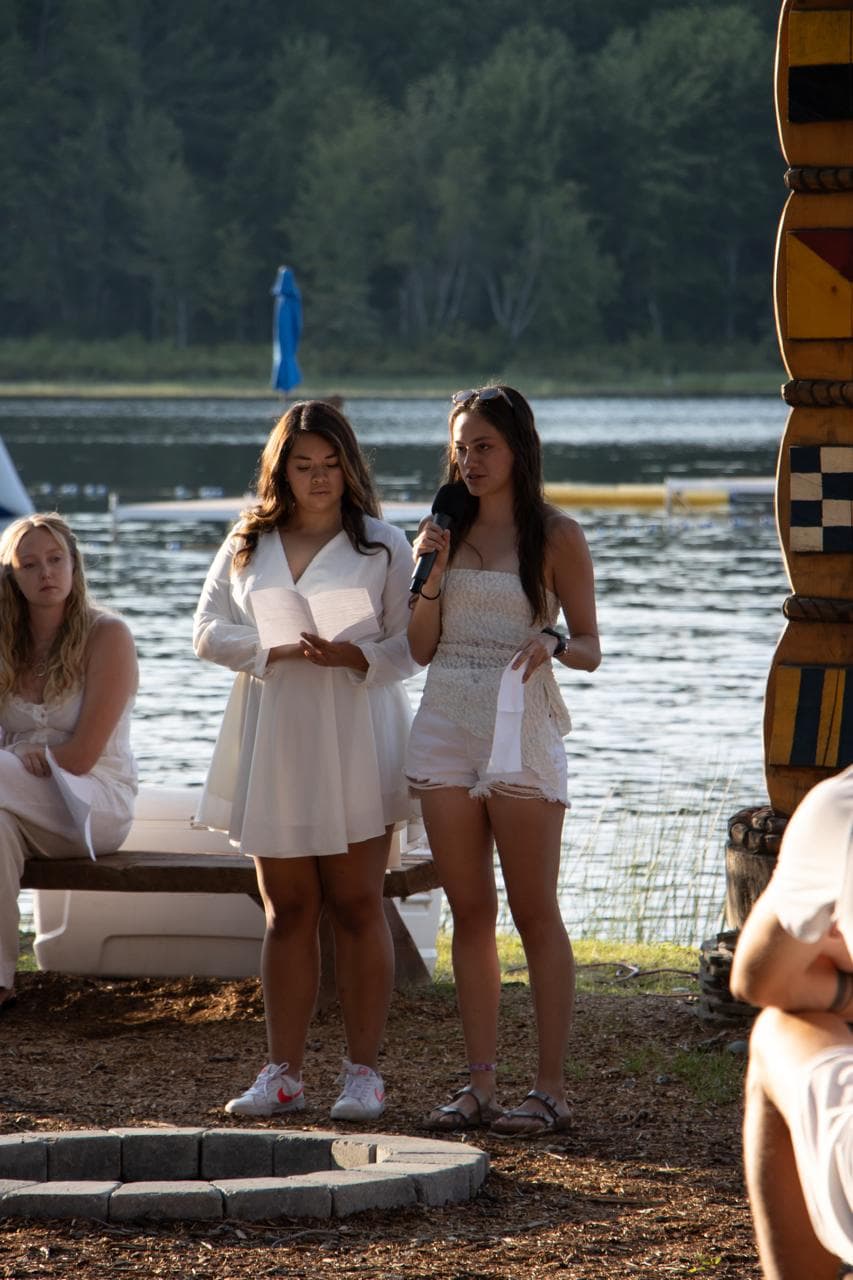 Valeria Mora speaking into a microphone outdoors